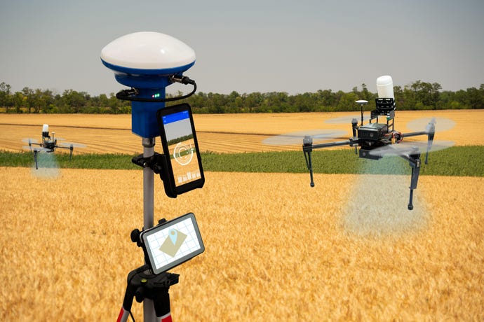 IoT farming drones hovering over a field