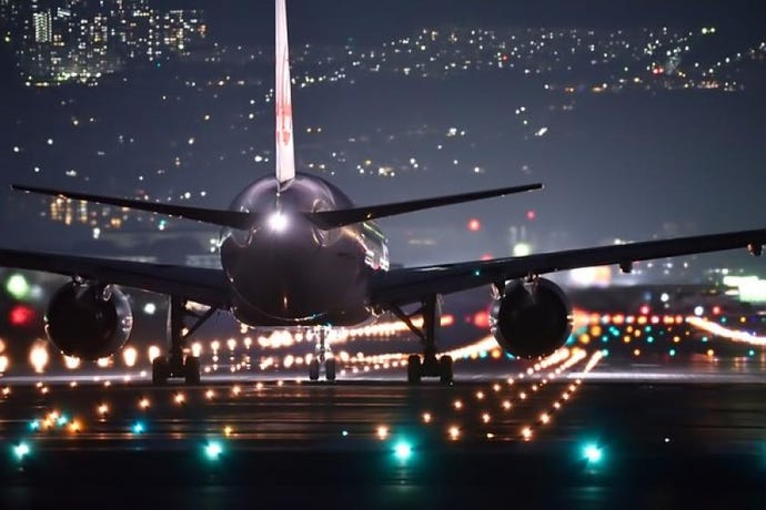 Airplane on runway during night