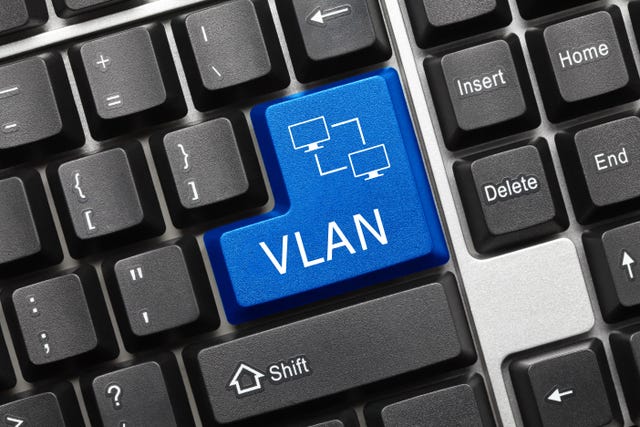 A keyboard with a blue key marked VLAN