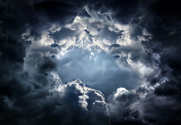Light seen through dramatic dark clouds