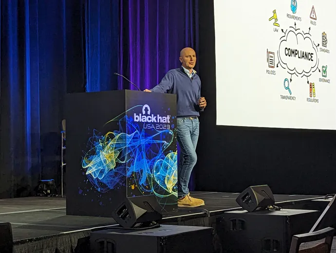 John Caruthers on stage at Black Hat