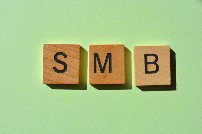 wood tiles spelling out S-M-B