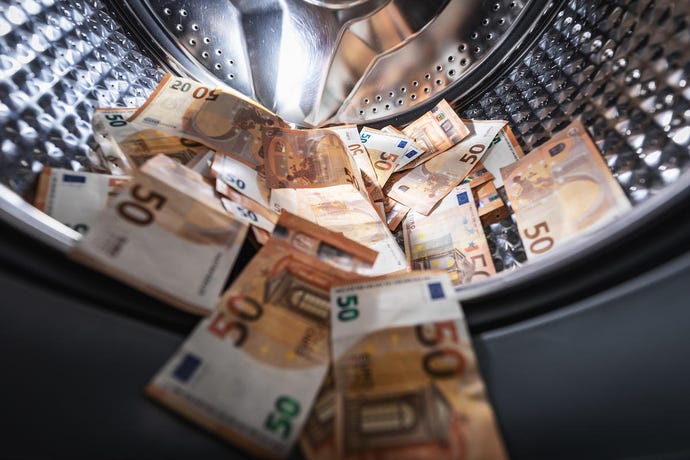 concept photo of money in a drying machine
