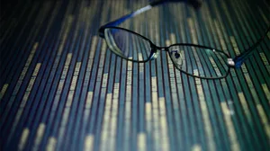 Glasses placed on a digital display of data. Glasses placed on a digital display of data.