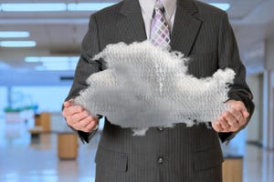 business person holding a cloud in his hands