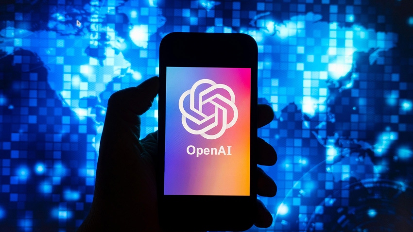 Digital composite image of OpenAI ChatGPT chatbot logo shown on mobile phone