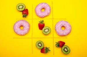 a tic tac toe board with donuts and fruits showing junk vs. substance