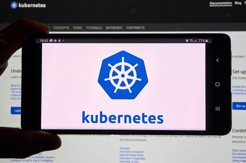 Kubernetes mobile app and logo on screen.