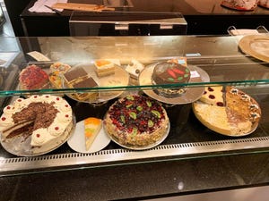 delicious cakes in a bakery store display counter