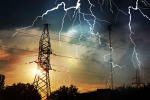 lightning storm over high voltage towers