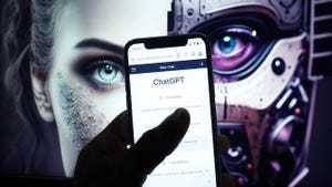 Mobile phone with Chat GPT-4 website artificial intelligence company OpenAI LLC on screen with half human half android face.