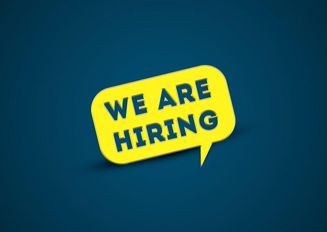 We are Hiring yellow speech bubble on blue background With Business Hire message. 