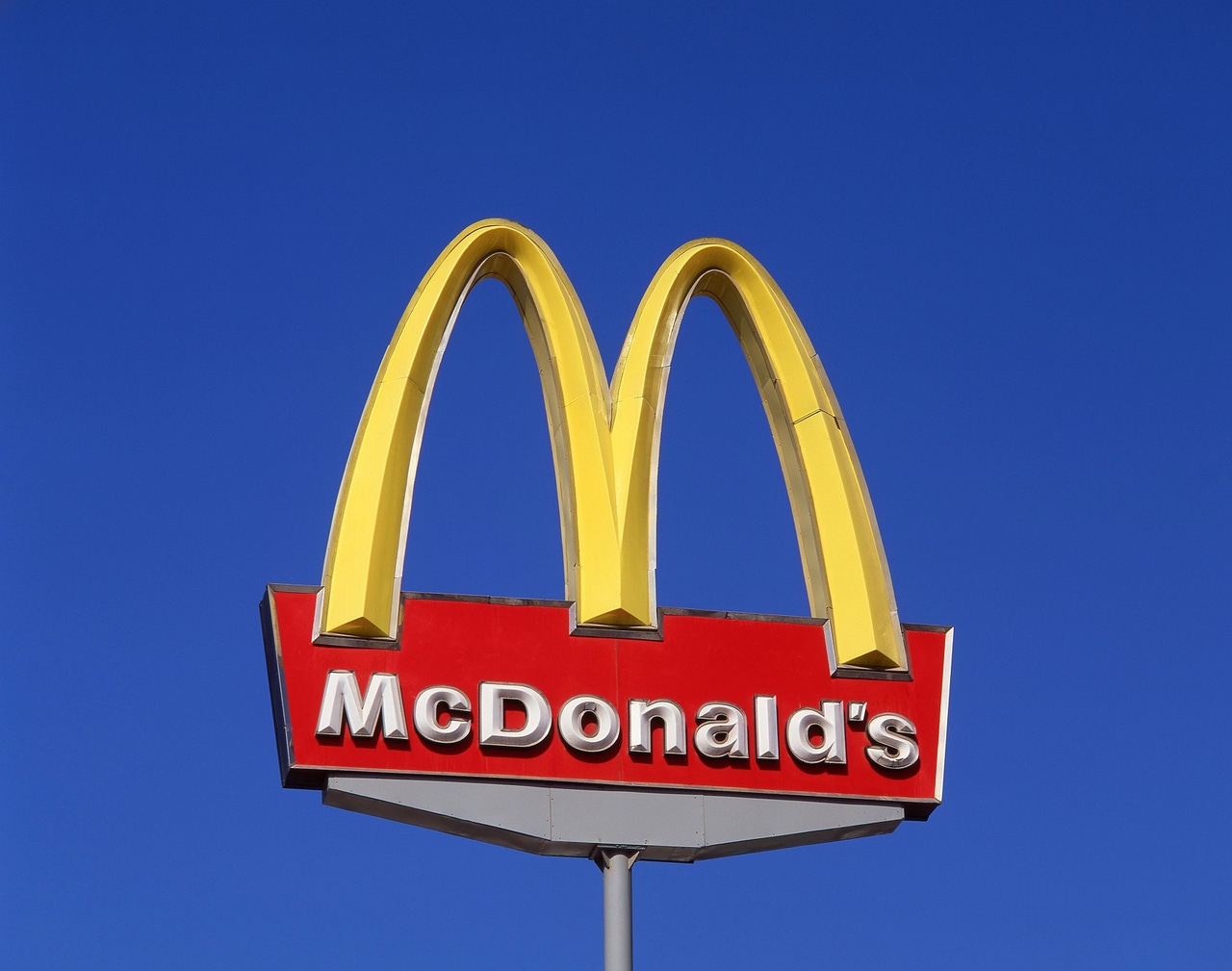 McDonald's entrance sign, golden arch McDonald's entrance sign, golden arch