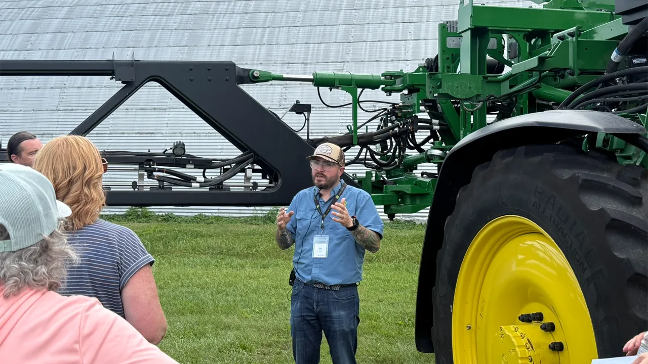 Josh Ladd, group product marketing manager for John Deere, provides a demonstration of a John Deere sprayer in Ames, Iowa