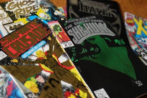 pile of comic books with colorful covers, including the Sensational She-Hulk 