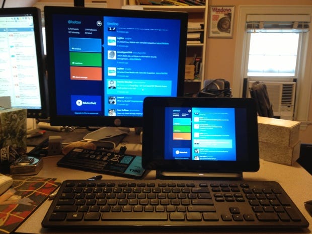 The Dell Latitude 10-ST2 in its docking station with monitor, wireless keyboard and mouse