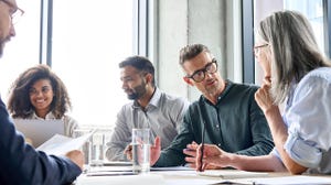 Executive team negotiating at boardroom meeting Executive team negotiating at boardroom meeting