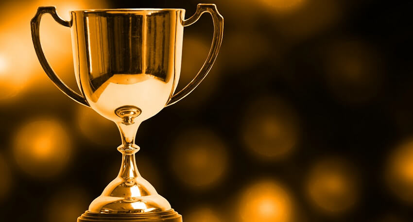 Winner trophy with abstract bokeh light background.