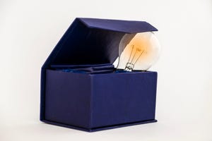 lightbulb sticking out of a blue box