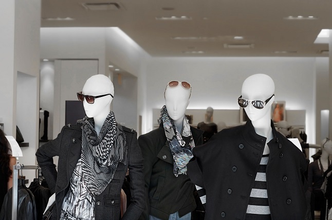 Fashion retail store with mannequins displaying mens and womens clothing merchandise