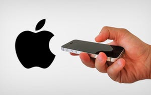 apple logo with a hand holding an iphone