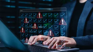 A user at a laptop, with an illustrated overlay of checkmarks and security alert icons A user at a laptop, with an illustrated overlay of checkmarks and security alert icons
