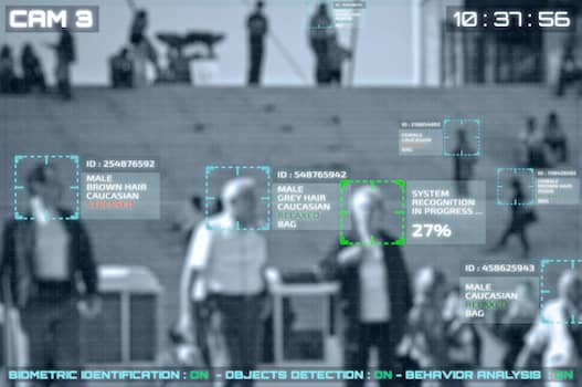 blurry image of people on steps with software framing their faces in green squares next to identifying text
