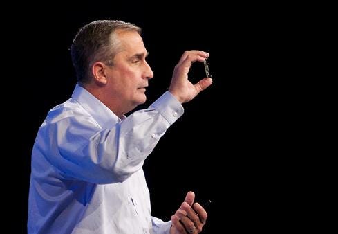 Intel CEO Brian Krzanich holds up his company's IoT-oriented Edison SoC. 