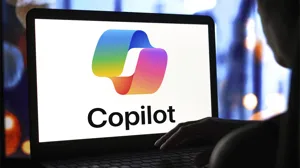 The Microsoft Copilot logo is displayed on a laptop screen. The Microsoft Copilot logo is displayed on a laptop screen.