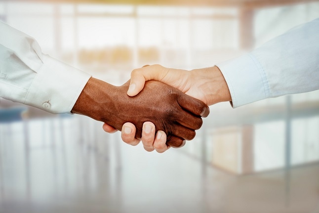 Close-up of hands shaking over a good business agreement.