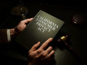 businessman holding book on California Consumer Privacy Act