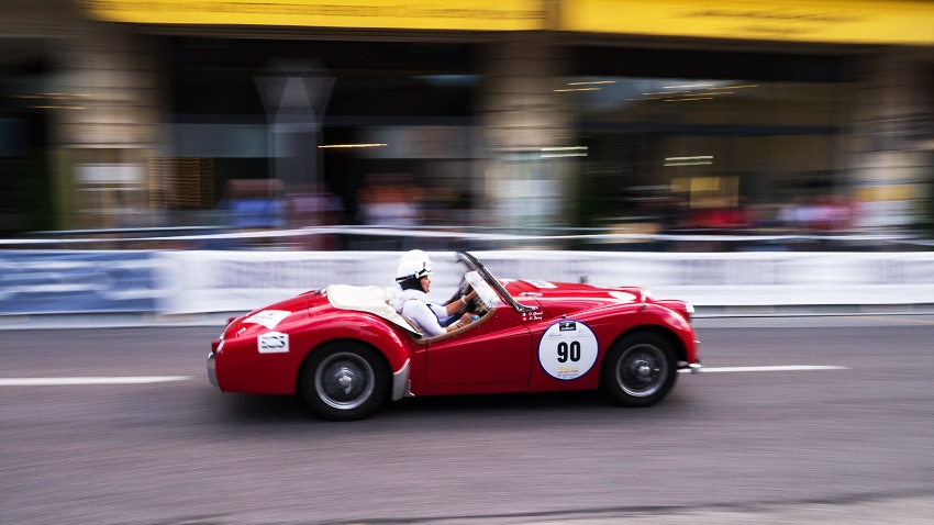  red car with number 90 races on the streets of Montreux, Switzerland
