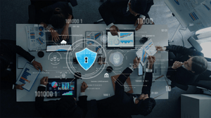 A top view of a professional business meeting focusing on cybersecurity analytics with digital lock icon overlay. A top view of a professional business meeting focusing on cybersecurity analytics with digital lock icon overlay.