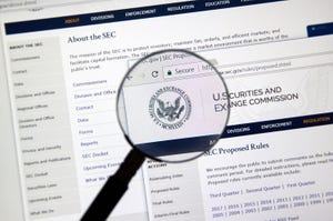 SEC webpage under magnifying glass.