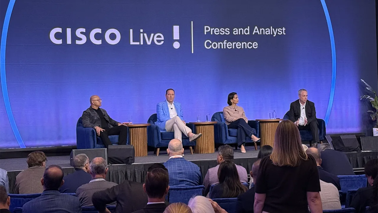 Cisco executives Jeetu Patel, left, Chuck Robbins, Liz Centoni and Steve Clayton on stage Cisco executives Jeetu Patel, left, Chuck Robbins, Liz Centoni and Steve Clayton on stage