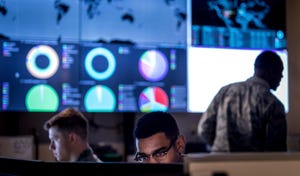 Cyber warfare operators at work in dark room