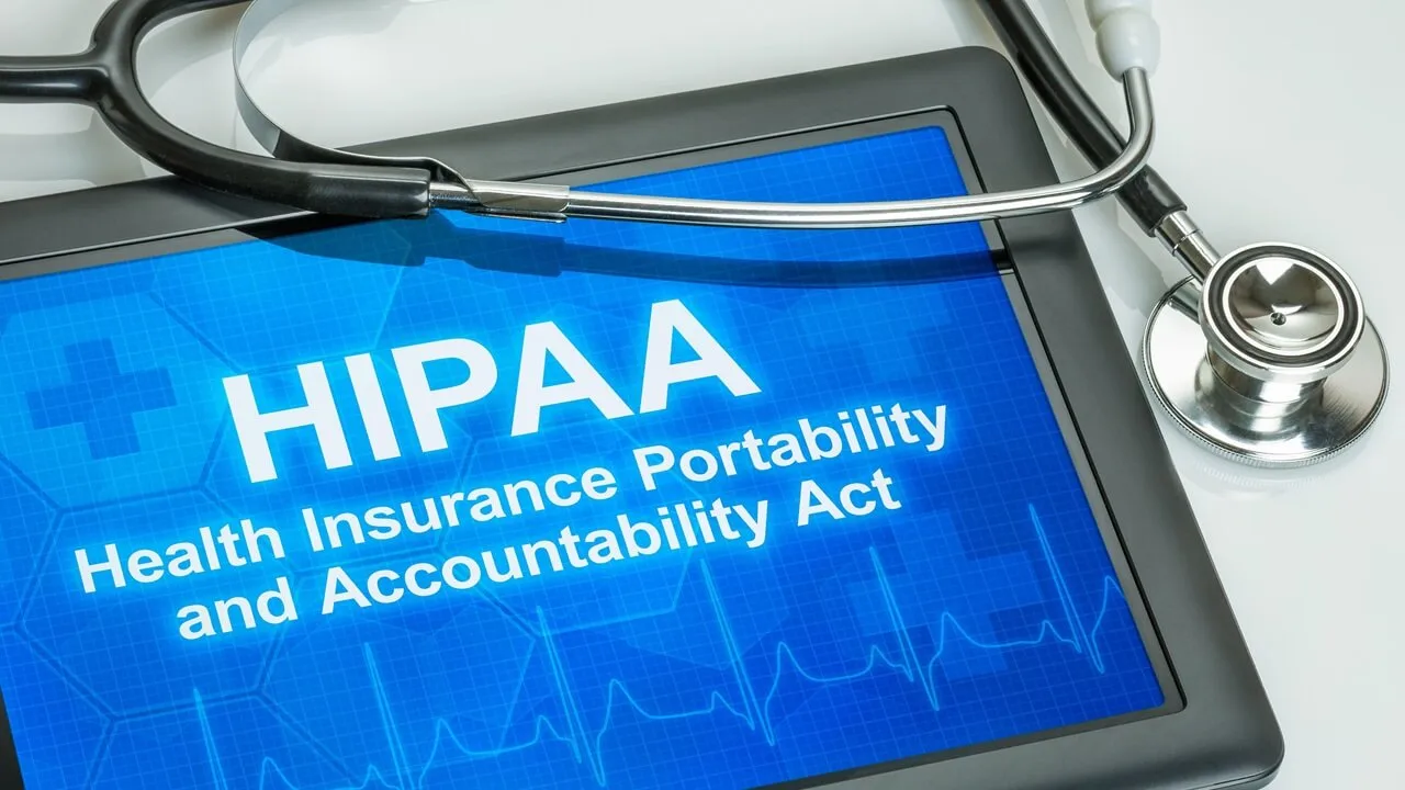 Tablet with the text HIPAA on the display. Tablet with the text HIPAA on the display.