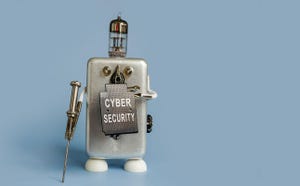 The robot holds a shield with the inscription cybersecurity.