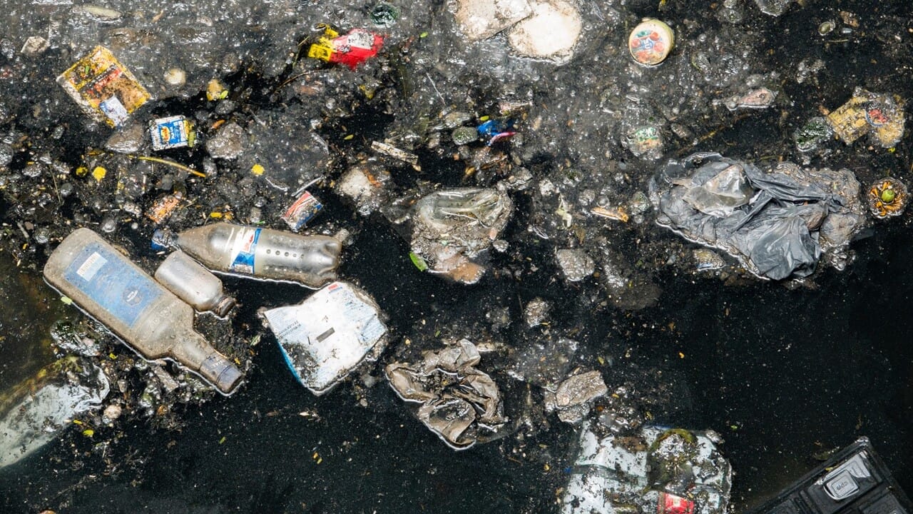 Pollution floating in river, Mumbai, India Pollution floating in river, Mumbai, India