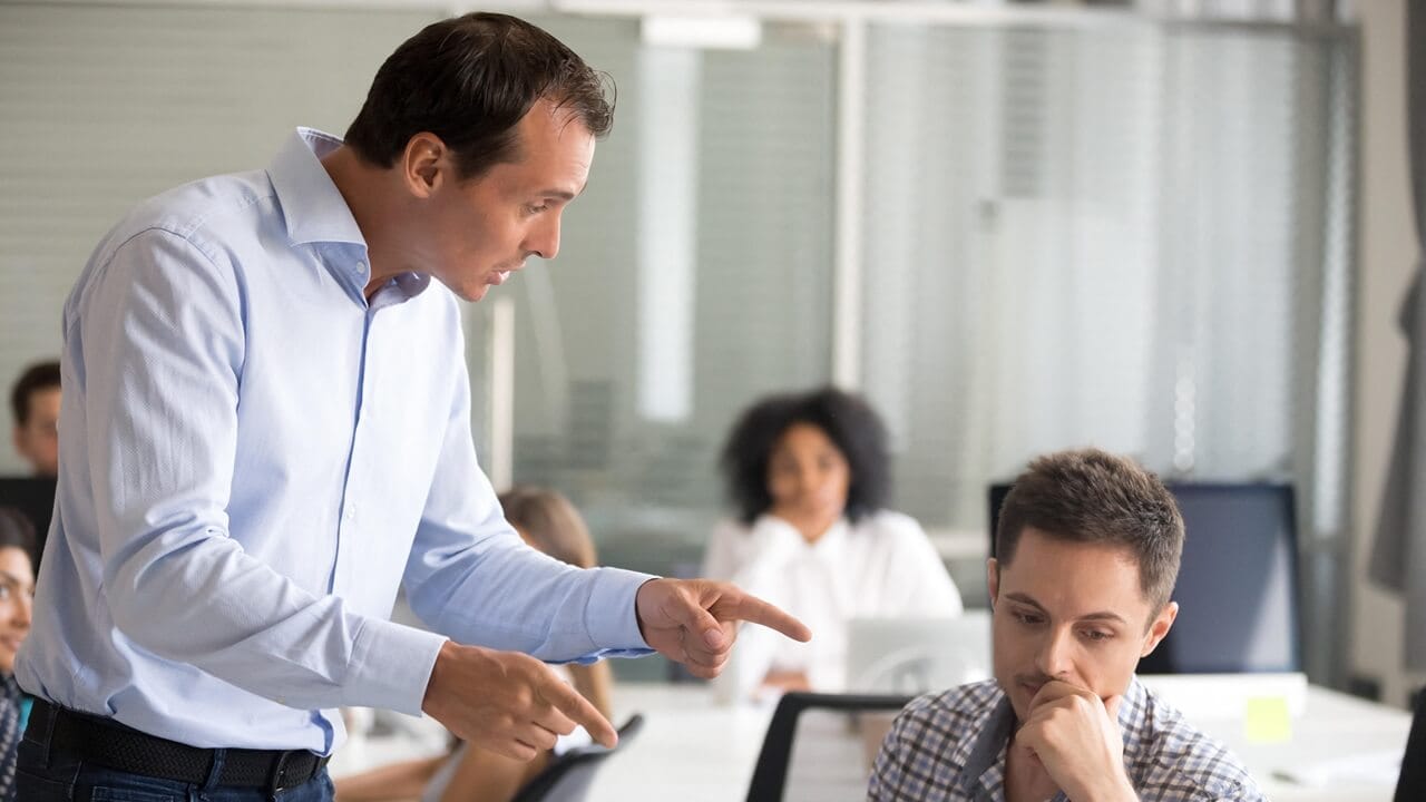 Angry boss is scolding frustrated employee Angry boss is scolding frustrated employee