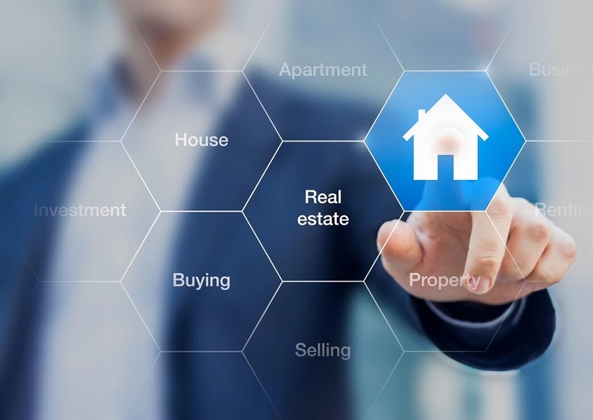 man pressing a "house" button indicating real estate transaction