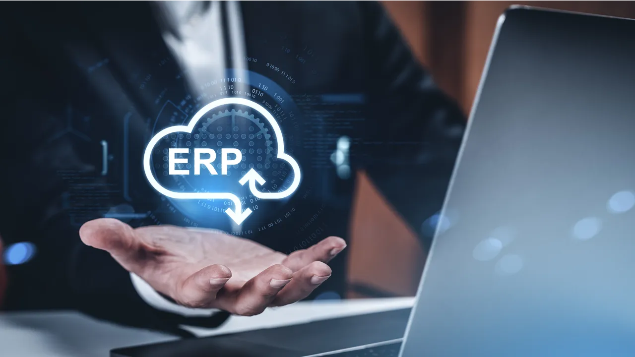 An IT executive presents an ERP cloud system icon with a holographic interface concept An IT executive presents an ERP cloud system icon with a holographic interface concept