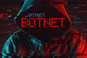Botnet concept with faceless hooded male person, low key red and blue lit image