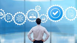 A male executives looks at icons representing technology platforms A male executives looks at icons representing technology platforms