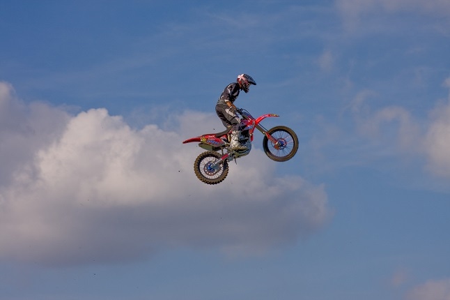 stunt bike rider high in the air