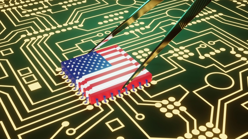 An advanced CPU printed with a flag of USA being held by tweezers on a neon glowing electronic circuit board.
