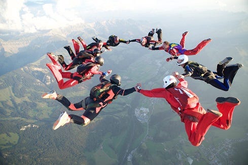 skydivers in star formation