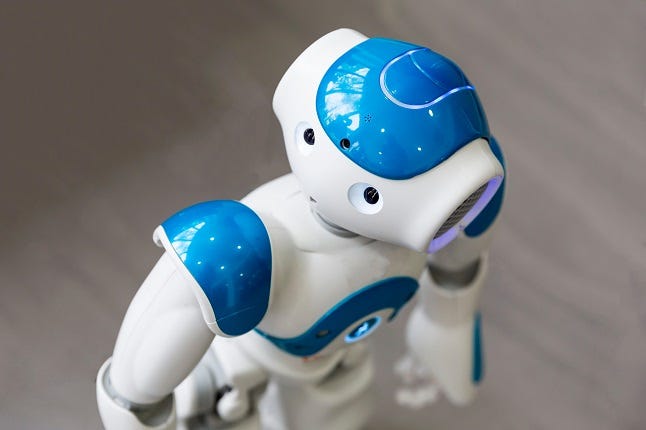 A small robot with human face and body - humanoid. Artificial Intelligence