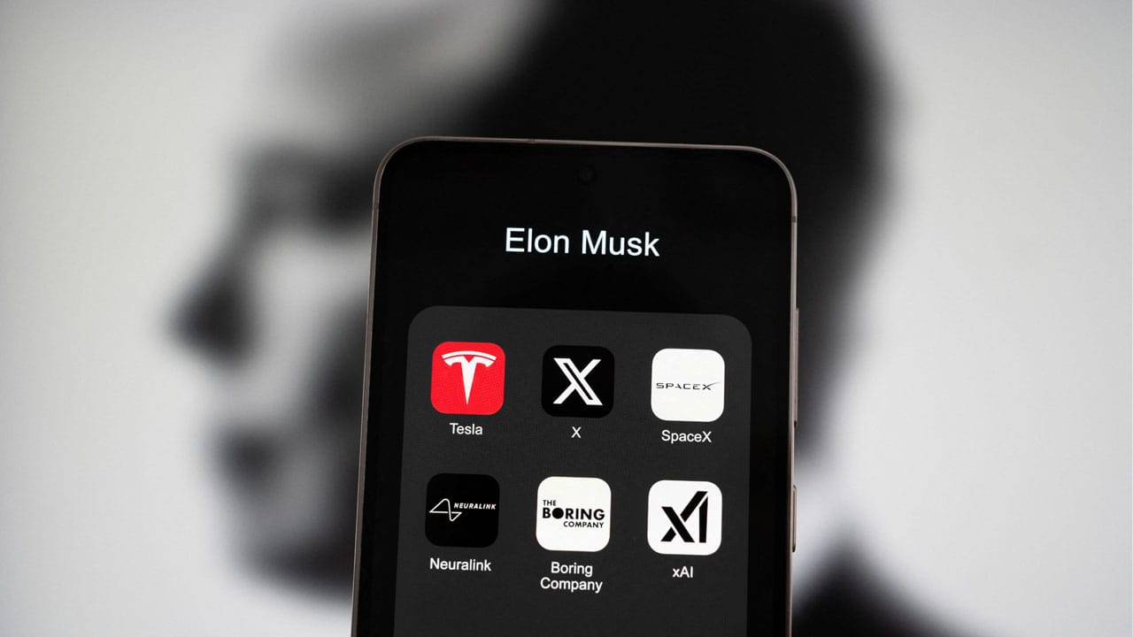 Smartphone with Twitter, Tesla, X, SpaceX and other icons representing companies owned by Elon Musk Smartphone with Twitter, Tesla, X, SpaceX and other icons representing companies owned by Elon Musk