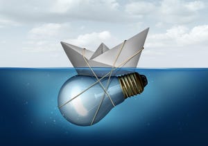 Business innovative solution and creative concept as a paper boat tied to a light bulb